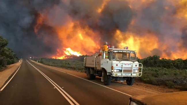 Firefighters watch the blaze on Kangaroo Island. Picture: Hugh Watters