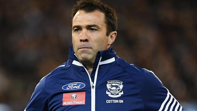 Geelong Cats head coach Chris Scott runs from the field during the AFL first qualifying final match.