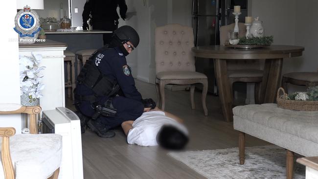 Police detain a man last month. Picture: NSW Police