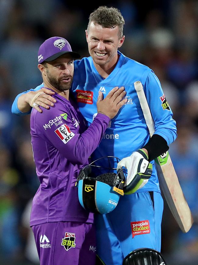 Peter Siddle (right) congratulates Matthew Wade on the Hurricanes’ victory. Picture: James Elsby/Getty