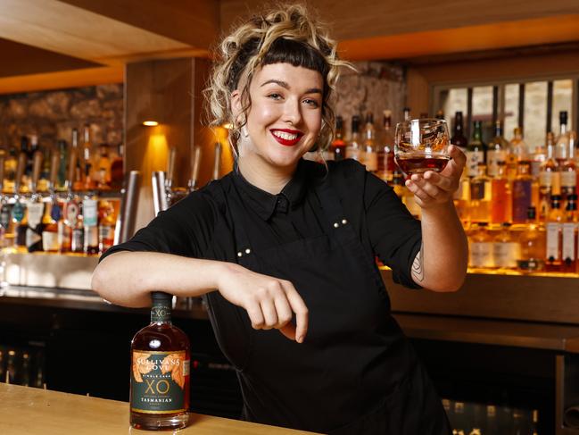 Dante Bott-Wakelam, from The Den, holds a Sullivans Cove brandy that has just won the top honour in the wine brandy category at the 2021 World Brandy Awards in London. Picture: Zak Simmonds