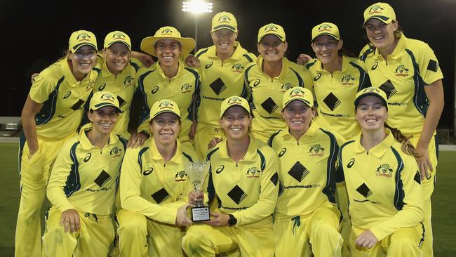 The Australian Southern Stars team pose with the trophy after their 4-0 series victory after winning the women's one day international match at Coffs Harbour.