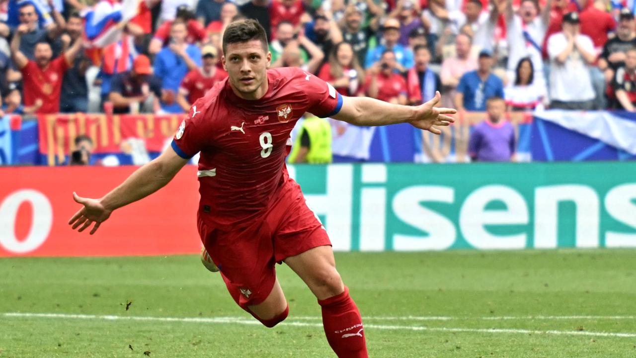 Serbia's forward #08 Luka Jovic celebrates after scoring his team's first goal during the UEFA Euro 2024 Group C football match between Slovenia and Serbia. (Photo by Miguel MEDINA / AFP)