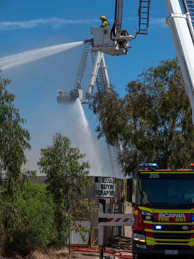 Fire crews battling a major blaze at Wingfield with 40 vehicles on fire in a scrap metal yard. Picture: NCA NewsWire / Naomi Jellicoe