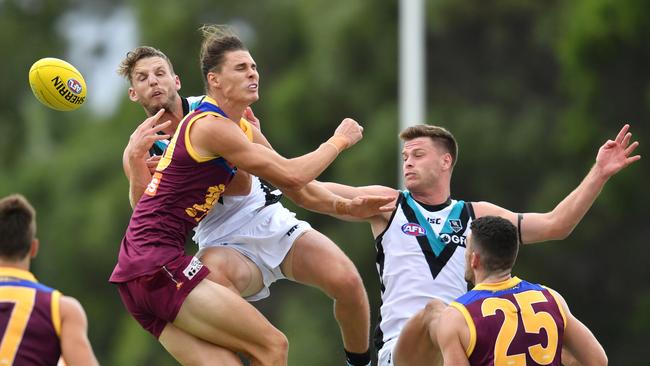 Eric Hipwood (centre) of the Lions. Picture: AAP Image/Darren England