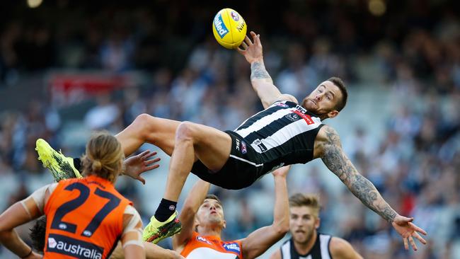 Jeremy Howe of the Magpies takes a heavy tumble against GWS. Picture: Scott Barbour/Getty Images