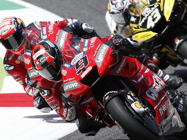 Italy's Danilo Petrucci leads Italy's Andrea Dovizioso during the MotoGP Grand Prix of Italy at the Mugello circuit, in Scarperia, Italy, Sunday, June 2, 2019. (AP Photo/Antonio Calanni)