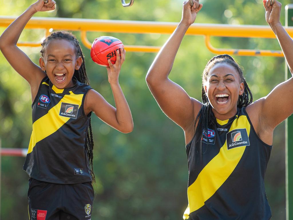 AFLW player and SAS TV star Sabrina Frederick with her mini-me little league legend Sunny, 8 pretending to do the obstacles like Sabrina had to in her SAS training. Picture: Jason Edwards