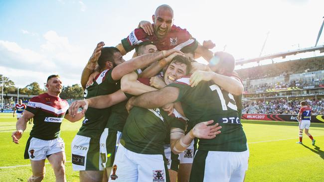 Lebanon players celebrate their victory over France at the Rugby League World Cup. Photo: NRLPhotos.com