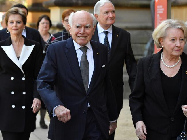 Former prime minister John Howard and wife Jeanette arrive, with former premier Nick Greiner behind. Picture: AAP