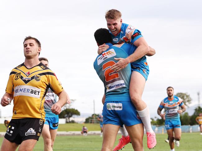 Pride's Will Partridge celebrates with Robert Derby after he scores a try in the Hostplus Cup Queensland Rugby League (QRL) match between the Northern Pride and the Sunshine Coast Falcons, held at Barlow Park, Cairns Picture: Brendan Radke