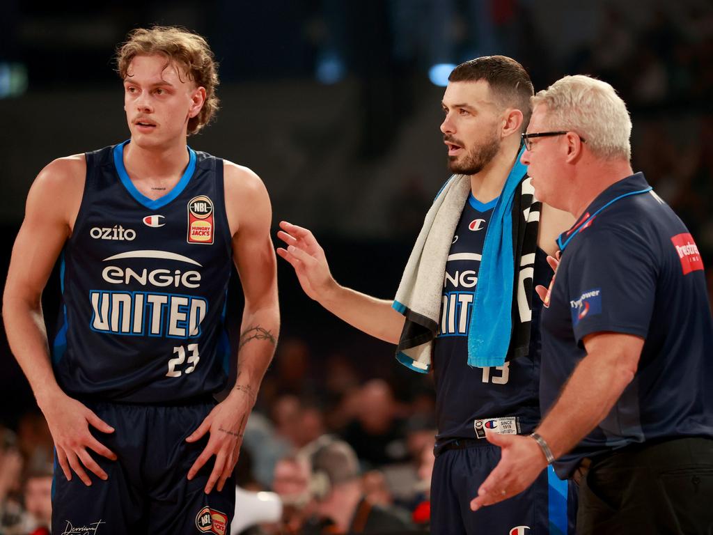 Luke Travers and Chris Goulding with Melbourne United coach Dean Vickerman, who remains confident his troops can bounce back and force a Game 5. Picture: Getty Images