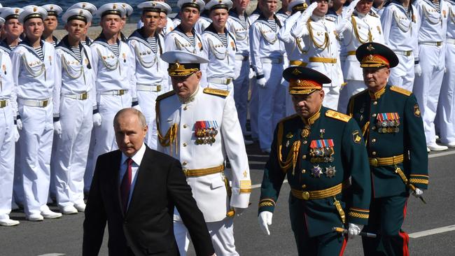 Russian President Vladimir Putin, accompanied by Defence Minister Sergei Shoigu and Commander-in-Chief of the Russian navy, Admiral Nikolai Yevmenov. Picture: AFP