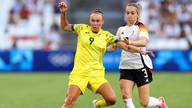 MARSEILLE, FRANCE - JULY 25: Caitlin Foord #9 of Team Australia is challenged by Kathrin Hendrich #3 of Team Germany during the Women's group B match between Germany v Australia during the Olympic Games Paris 2024 at Stade de Marseille on July 25, 2024 in Marseille, France. (Photo by Alex Livesey/Getty Images)