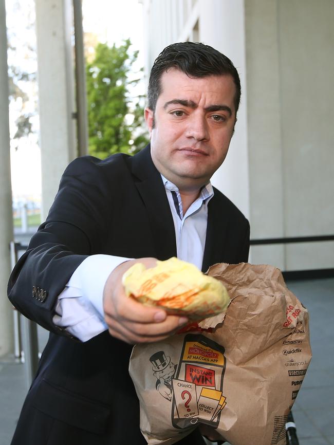 Senator Sam Dastyari with McDonalds at Senate Doors at Parliament House in Canberra. Picture Kym Smith