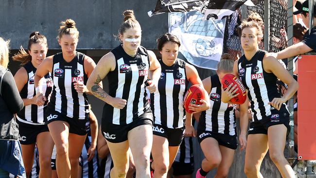 Brianna Davey, middle, and Stephanie Chiocci, right, have both re-signed at Collingwood. Picture: Kelly Defina/AFL Photos