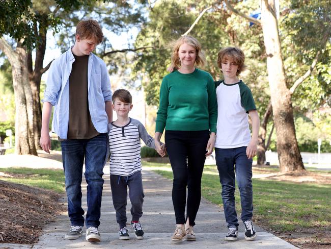 Anna Minns with kids Joe (14), George (5) and Nick (12) in Kogarah. Anna and Chris met as teens – and their shared values of family and social justice brought them together. Picture: Damian Shaw