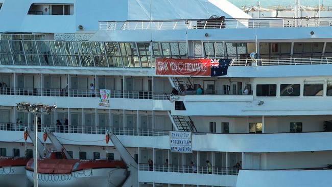 Passengers from the COVID-19 infected cruise ship MV Artania wait to be taken off the boat. Picture: AFP.