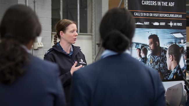 Royal Australian Air Force recruiters talk to students from St Andrew's College during their visit to RAAF Base Richmond, Sydney.