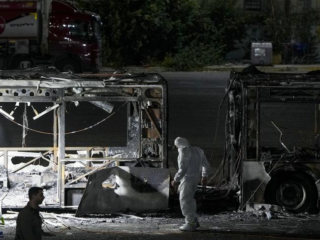 Israeli police inspect the scene of one of a series of bus explosions in what authorities said appeared to be a militant attack in Bat Yam, central Israel. Picture: AP