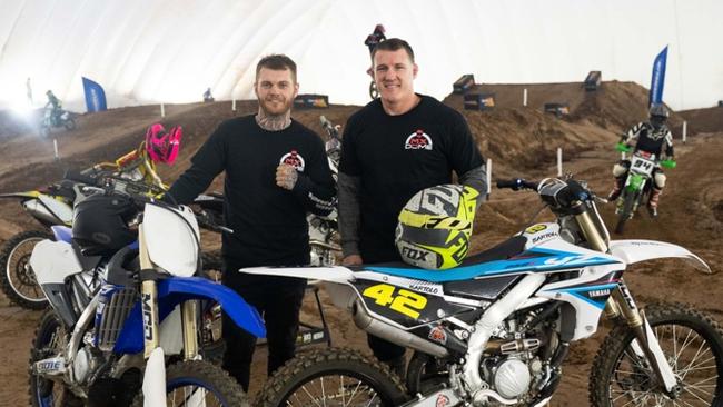 Boxer Daniel Lewis and retired NRL player Paul Gallen testing out their skills on a bike.