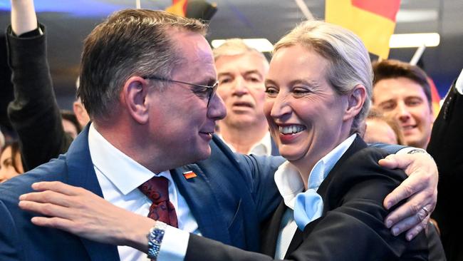 The AfD’s top candidate for Chancellor Alice Weidel and her party co-leader Tino Chrupalla hug during the electoral evening in Berlin, after the first exit polls in the German national elections. Picture: Soeren Stache/AFP