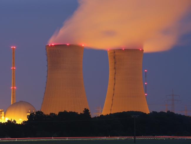 GRAFENRHEINFELD, GERMANY - JUNE 11:  Passing cars leave a streak of light as steam rises from the cooling towers of the Grafenrheinfeld nuclear power plant at night on June 11, 2015 near Grafenrheinfeld, Germany. The Grafenrheinfeld plant, which is owned by German utilitiy E.ON and has been in operation since 1981, is scheduled to cease operation later this month on June 27. Germany is withdrawing itself from nuclear energy reliance and has established ambitious goals for increasing its capacity of renewable energy sources.  (Photo by Sean Gallup/Getty Images)