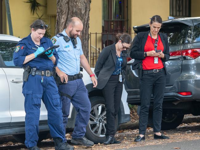 Police assemble outside the Raglan St crime scene on Wednesday morning. Picture: Thomas Lisson