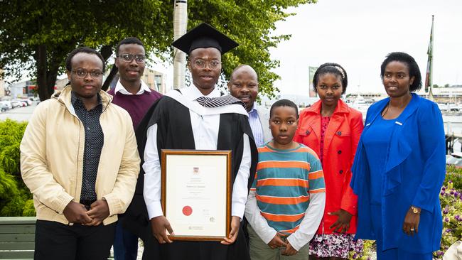 Festus Vyimana with family. University of Tasmania Graduations. Federation Concert Hall, Hobart. Picture: RICHARD JUPE