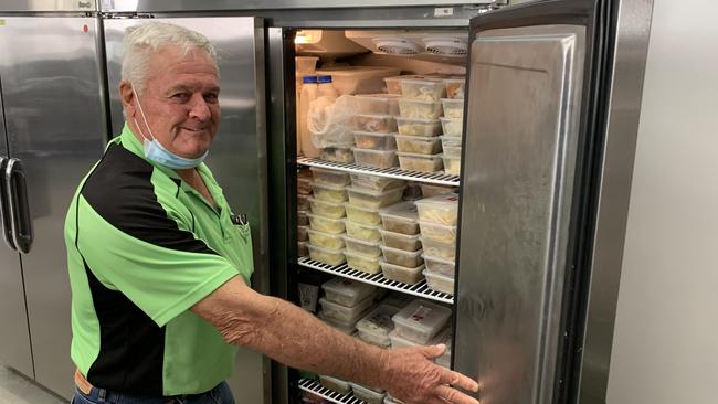 Ballina Hot Meal Centre chairman and president of the Rotary Ballina-on-Richmond Club, Col Lee, with some of the frozen meals prepared for those in need during the lockdown.