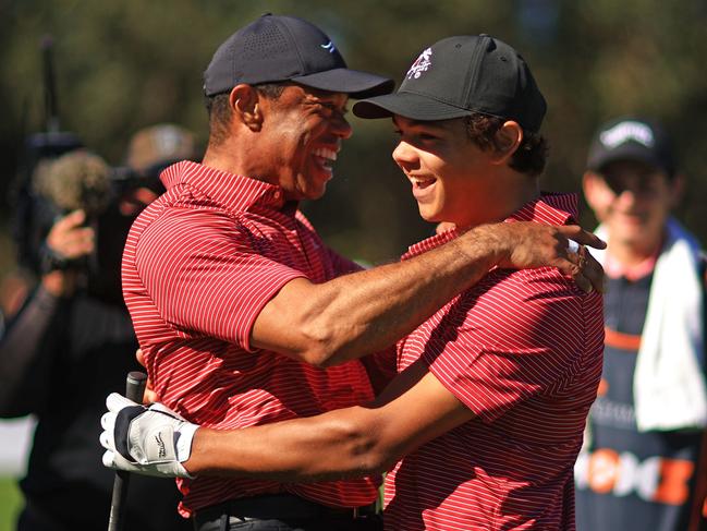 ORLANDO, FLORIDA - DECEMBER 22: Tiger Woods of the United States reacts with his son Charlie Woods after holing out on the fourth hole during the second round of the PNC Championship at Ritz-Carlton Golf Club on December 22, 2024 in Orlando, Florida. (Photo by Mike Ehrmann/Getty Images)