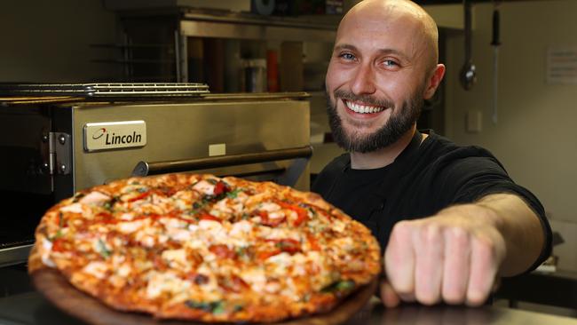 Ragazzi &amp; Co manager Simon Ward with his signature Ragazzi pizza. Picture: SAM ROSEWARNE