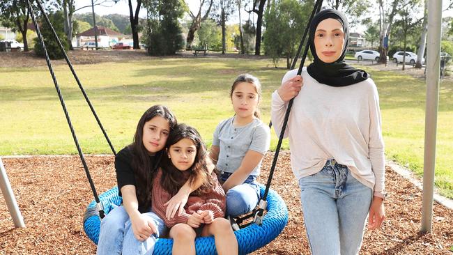 Rana Khalil with her children Zara 11, Maryam 5 and Amara 11, near their western Sydney home. Picture: John Feder