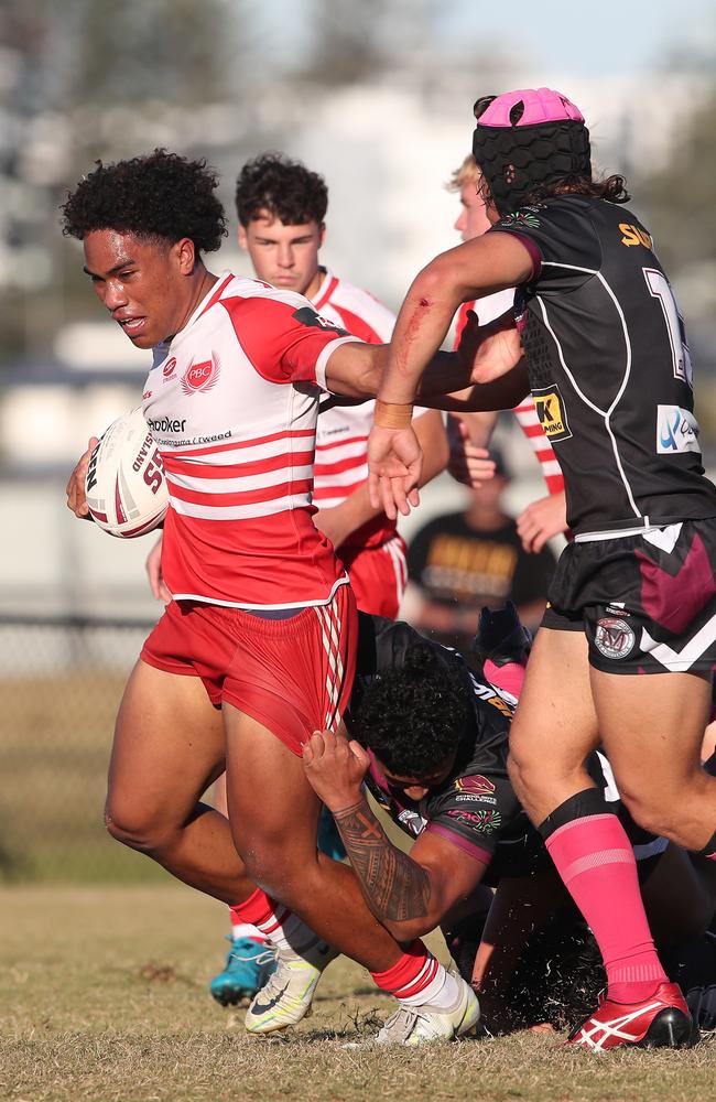 Langer Trophy game between PBC (red and white) and Marsden at Tugun. PBC's Barney Litidamu breaks through the Marsden line. . Picture Glenn Hampson