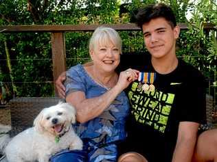 NOT FORGOTTEN: Georgie the dog and grandson Macka are happy to have Carleen Hawk's grandfather's medals home. Picture: Jann Houley