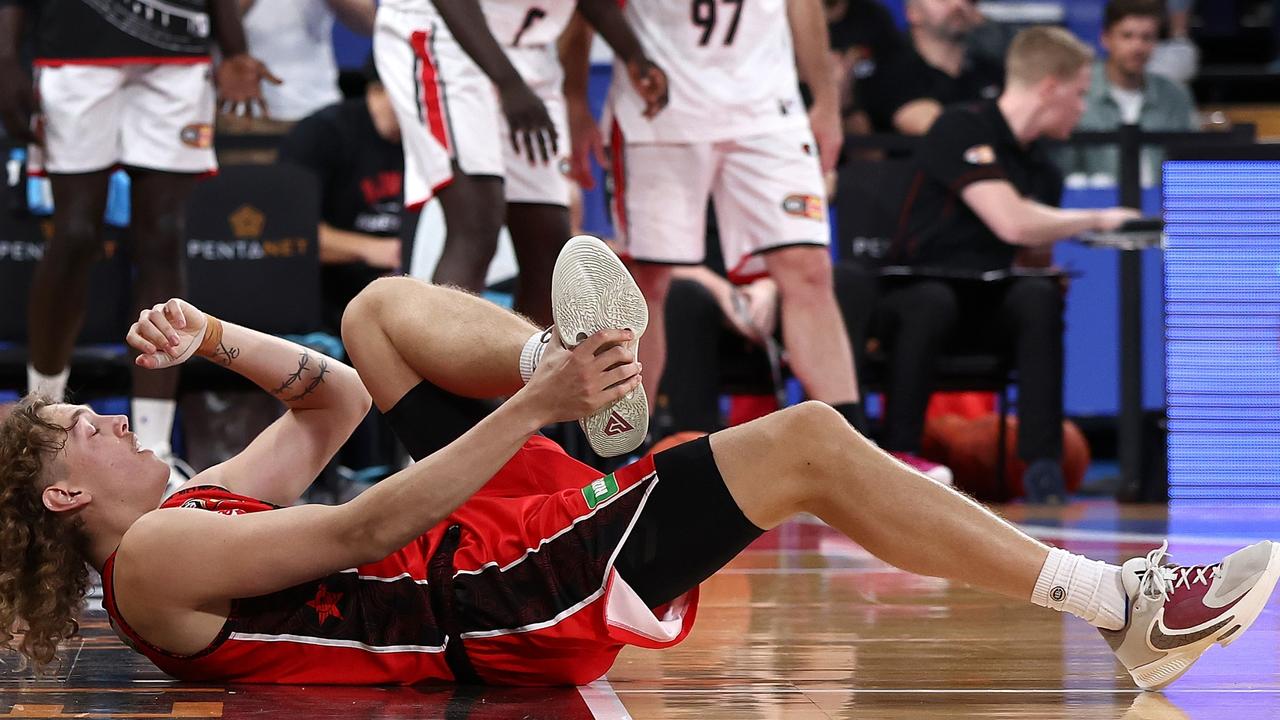 Wildcat Luke Travers was sent sprawling by Deng Deng. Picture: Getty Images