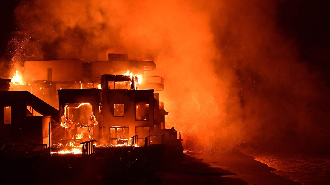 A beach house is engulfed in flames as the Palisades Fire burns. Picture: Agustin Paullier/AFP