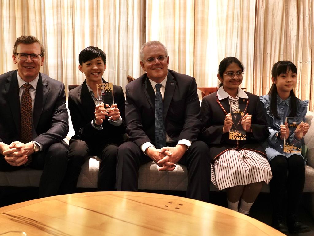 Prime Minister Scott Morrison hosts the winners of the Prime Minister's Spelling Bee competition Arielle Wong, 10 (year 3,4 winner), Theekshitha Karthik, 12 (year 5,6 winner), Evan Luc-Tran, 13 (year 7,8 winner) and presents them with their trophies at Parliament House on November 29, 2021. Picture: Adam Taylor