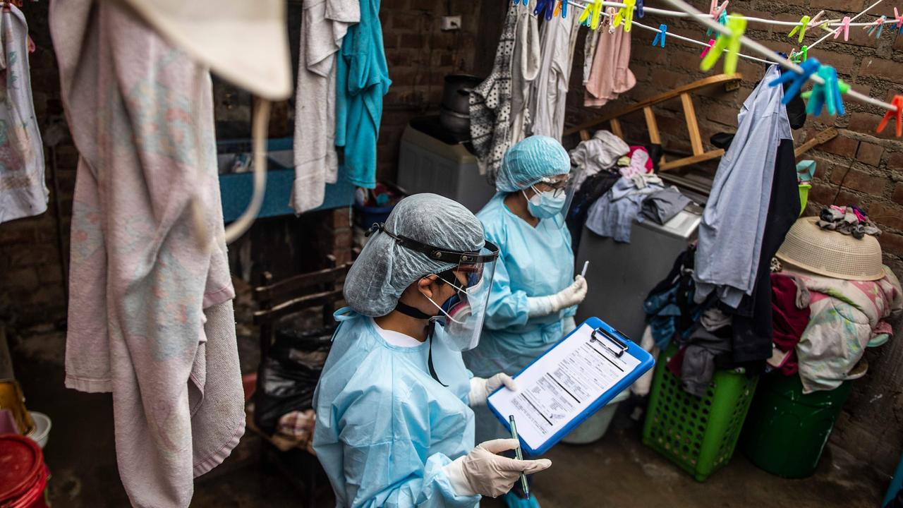 Doctors visit a patient in Chosica, east of Lima. Picture: Ernesto Benavides / AFP