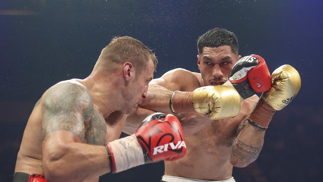 Jai Opetaia (right) wants a megafight with Tyson Fury. Picture: Getty