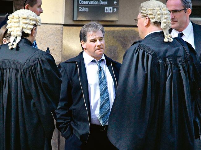 Robert Farquharson (centre) with his legal team at an earlier trial. Picture: Craig Borrow