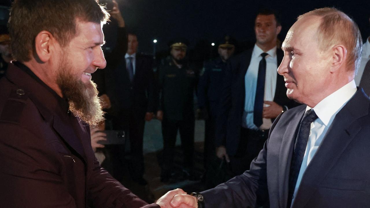 President Vladimir Putin shakes hands with Ramzan Kadyrov on arrival at Grozny airport. Picture: Vyacheslav Prokofyev/pool/AFP