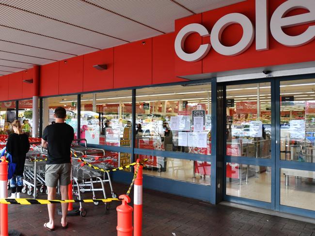 Shoppers wait outside a Coles supermarket at Firle in Adelaide, Monday, April 6. Picture: AAP Image/David Mariuz