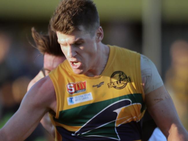 13/05/17 - SANFL EAGLES versus GLENELG at Woodville Oval. Eagle's Paul Stewart clears under pressure. Picture Dean Martin