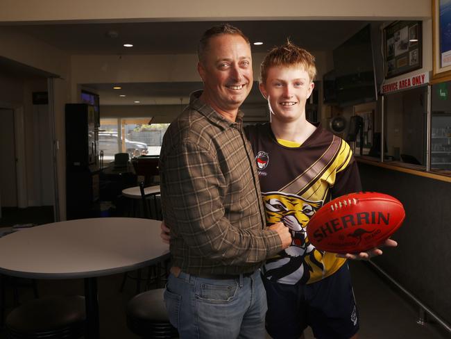 SUN TAS.  Grant Pitchford president of the Kingston Beach RSL Club with son Mac Pitchford 16 who plays football with Kingborough Tigers Football Club.  Kingston Beach RSL Club is one of the livesites that will host a watch event for the Tasmanian AFL club announcement of it's name and colours.  Picture: Nikki Davis-Jones