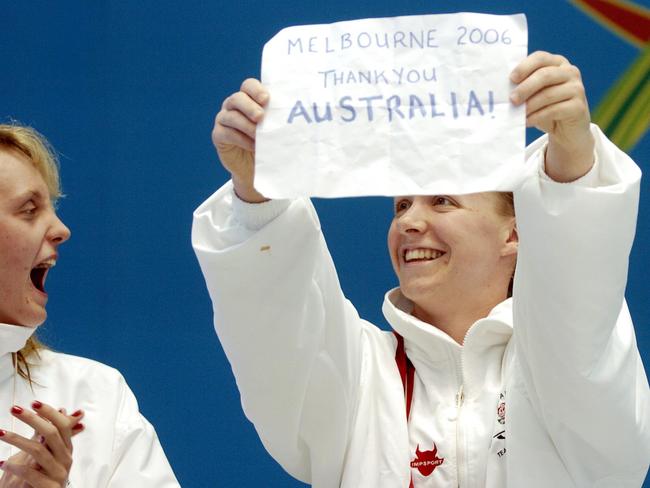Melanie Marshall holds up a sign thanking Australia after she won a silver medal for England at the 2006 Commonwealth Games in Melbourne. Picture: AAP Image/Dean Lewins