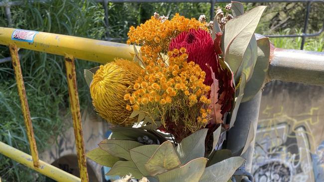 Flowers have been left around the entrance to the drain following the tragedy.