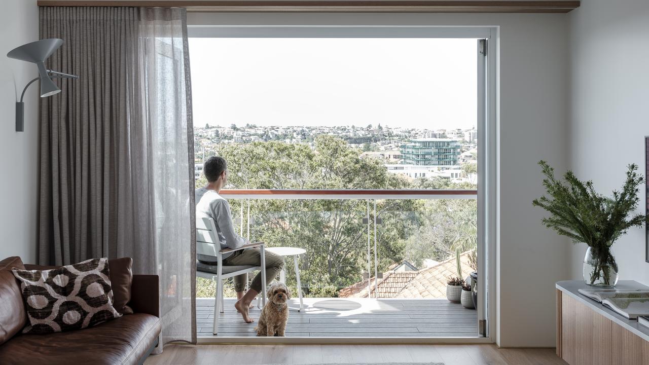 The glass balustrades on John and Joey’s Bondi apartment flood the apartment with natural light.