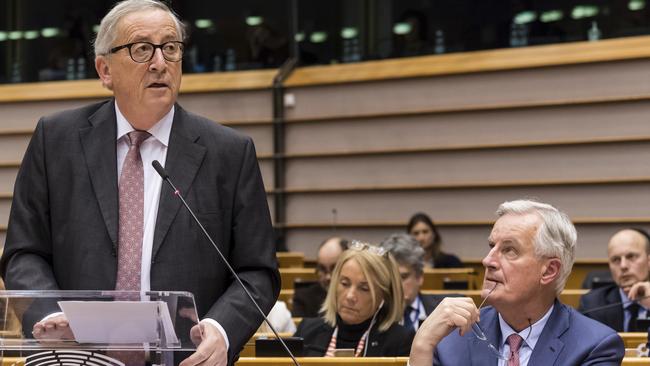 EU Commission President Jean Claude Juncker, left, stands next to European Union chief Brexit negotiator Michel Barnier as he addresses MEPS in Brussels. Picture AP.