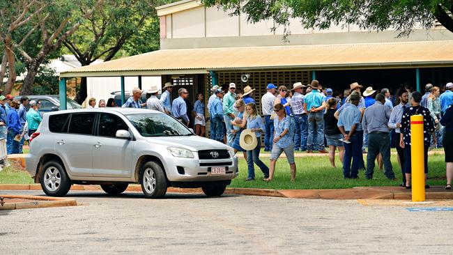 Family and friends depart Casuarina Street primary school after Dolly Everett's memorial service in Katherine, Northern Territory.